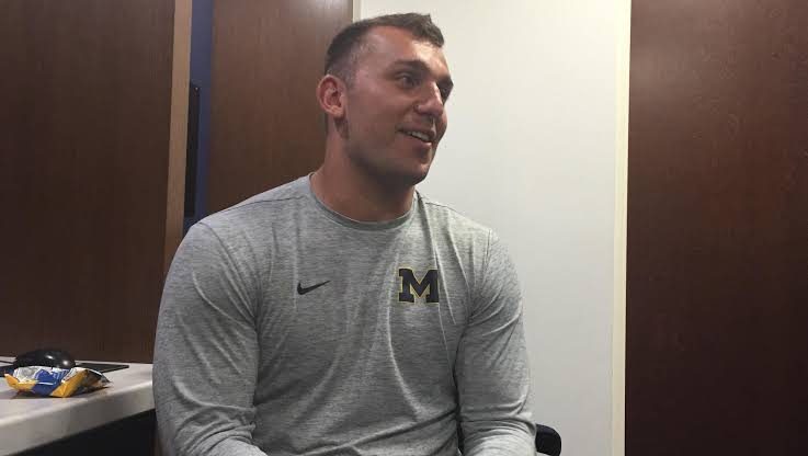 Hirsch talking with reporters